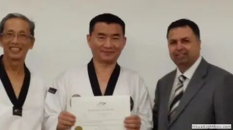 Master Kim with the WTF Referee Director, 2014